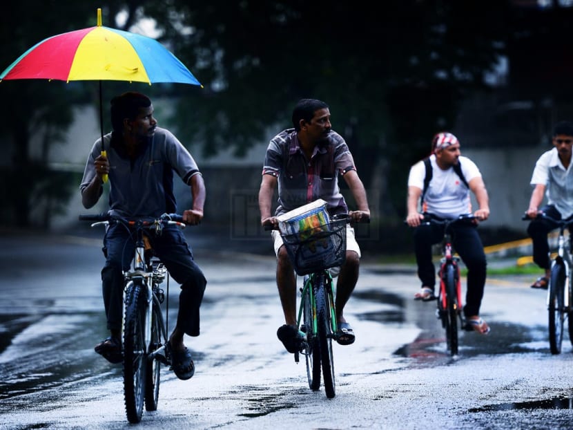 A group of foreign workers cycle home after work in Petaling Jaya. Photo: The Malaysian Insider