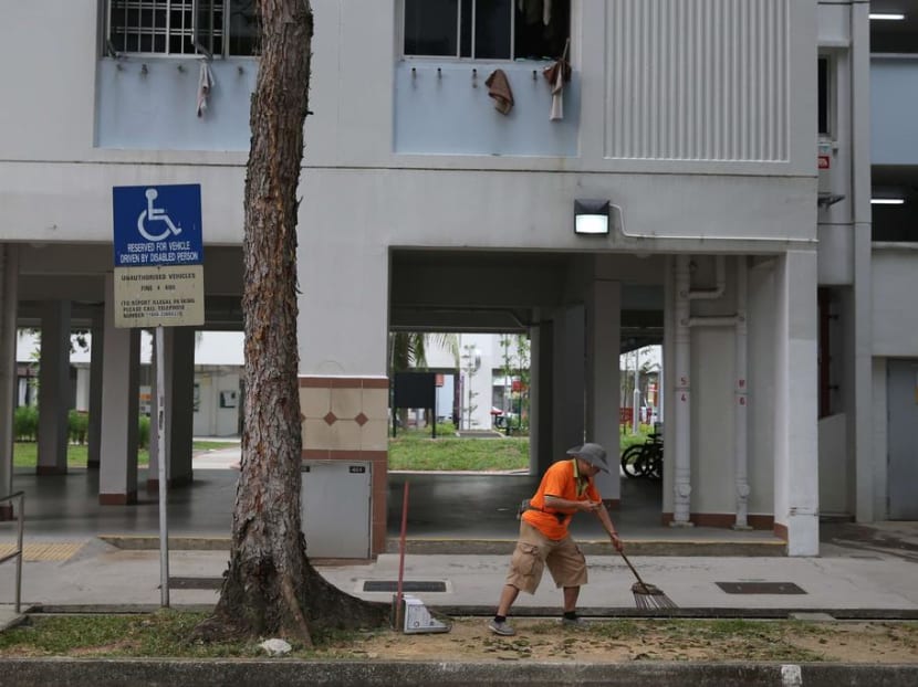 An estate cleaner at a block of flats along Yishun Avenue 2. An estate cleaner at a block of flats along Yishun Avenue 2.