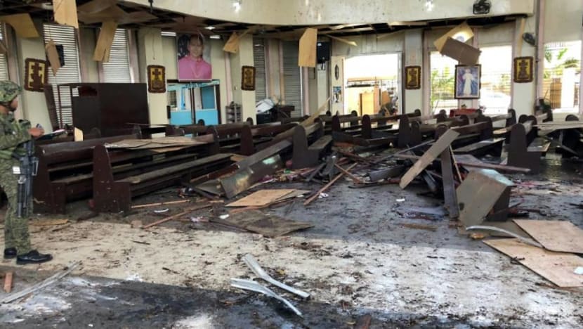 Philippines vows to crush 'terrorists' after church bombs kill 20 Philippines vows to crush 'terrorists' after church bombs kill 20
