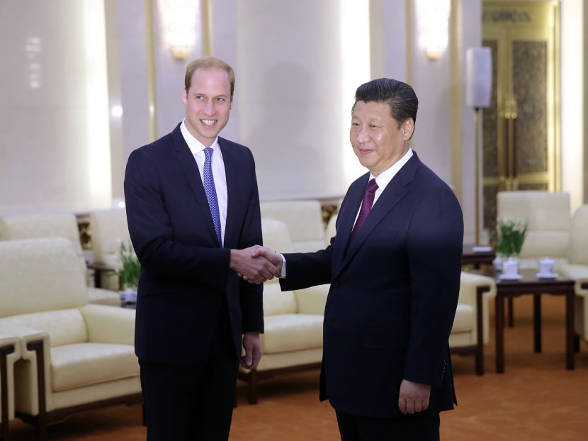 Prince William, Duke of Cambridge (Left) meets Chinese President Xi Jinping (Right) at the Great Hall of the People on March 2, 2015 in Beijing, China. Photo: Getty Images