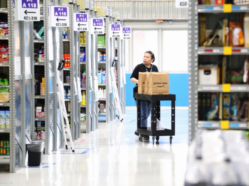 Amazon staff at the fulfilment centre during the launch of the company’s Prime Now two-hour delivery service in Singapore last week. Some shoppers were unable to place orders for days, while others had to wait several hours before they were given a delivery time slot. Photo: Koh Mui Fong
