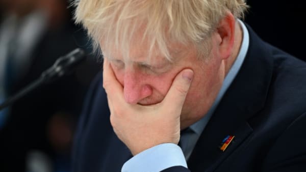 UK PM Johnson back in crisis mode after foreign tour