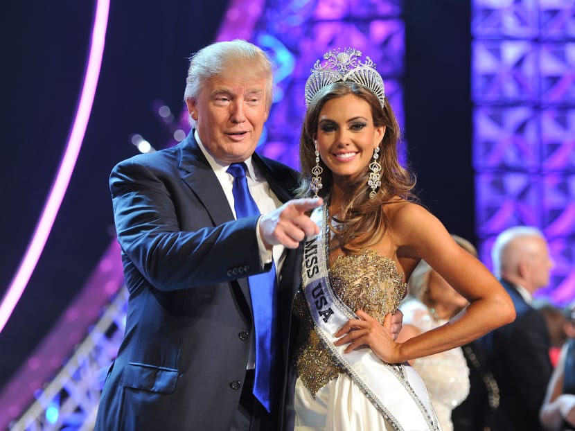 In this June 16, 2013 file photo, Mr Donald Trump, left, and Miss Connecticut USA Erin Brady pose onstage after Brady won the 2013 Miss USA pageant in Las Vegas, Nevada. Photo: AP