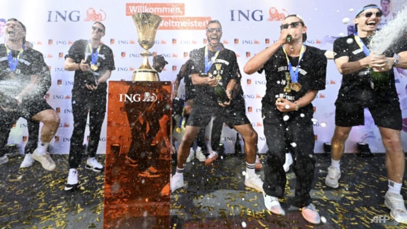 Schroder toasts 'crazy' fans as world champions return to Germany