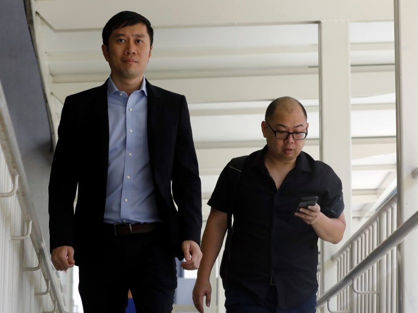 Human rights activist Jolovan Wham (L) arrives at the State Court in Singapore, February 21, 2019.