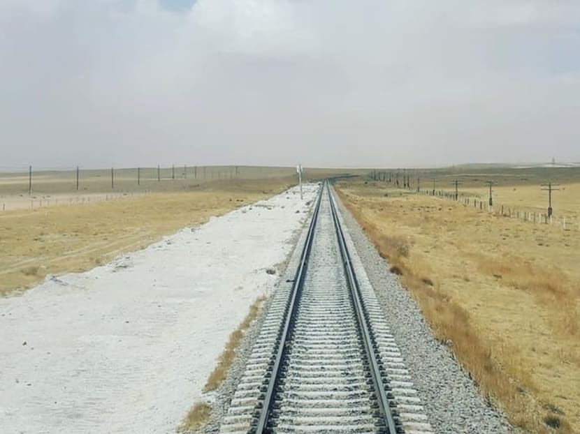 The rail track stretches for miles across the Mongolian plains which the author passed during his two-week train ride between the United Kingdom and China.