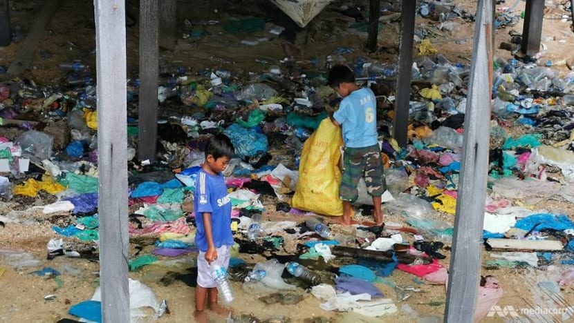 Living in a sea of trash: Sabah’s stateless children face bleak future 