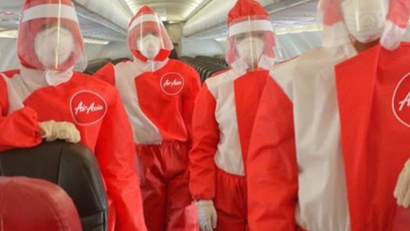 COVID-19: AirAsia trials PPE suits for cabin crew COVID-19: AirAsia trials PPE suits for cabin crew