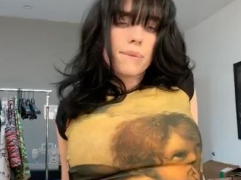 Billie Eilish gives fans peek of huge dragon tattoo after vowing they