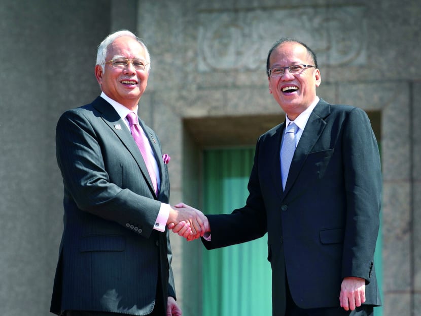 Mr Najib Razak (left) and President Benigno Aquino are seeking closer security relations. Photo: Bloomberg