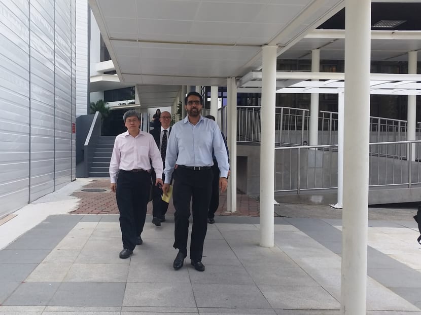 AHPETC vice-chairmen Png Eng Huat (left) and Pritam Singh leaving State Courts yesterday. Photo: Amanda Lee