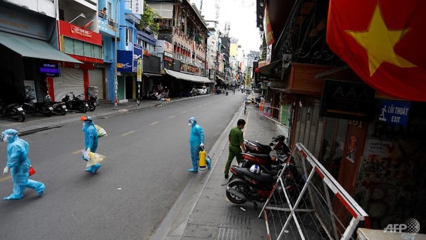 Vietnam sees record COVID-19 cases as curbs tighten Vietnam sees record COVID-19 cases as curbs tighten