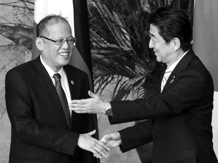 Mr Abe with Mr Aquino at the recently-concluded Japan-ASEAN summit. The Philippines’ ties with Japan are emerging stronger from the crisis, with Japanese assistance offered quickly and additional billions in aid pledged at the summit. Photo: Reuters