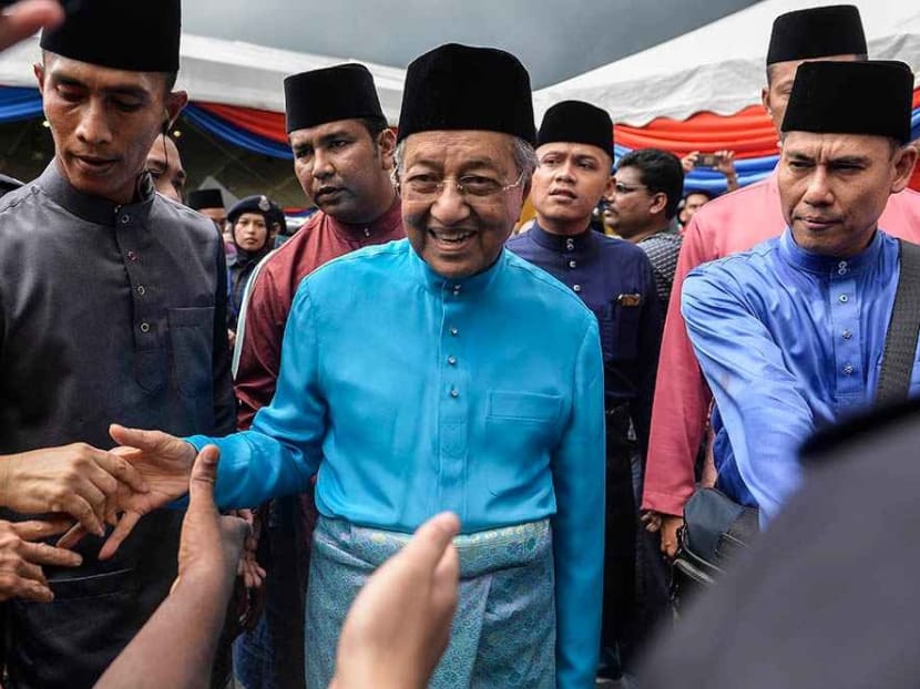 Dr Mahathir Mohamad greeting visitors to his Raya Open House at Seri Perdana, Putrajaya on June 5, 2019.