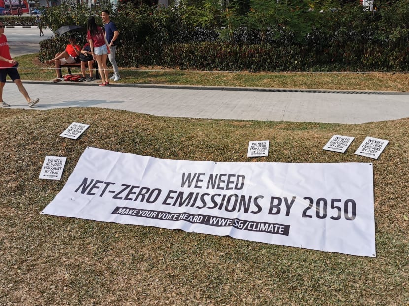 A banner at the Singapore climate rally at Hong Lim Park in Sept 2019. The author says that gloomy narratives are problematic because they tend to inspire inertia and anxiety rather than action.