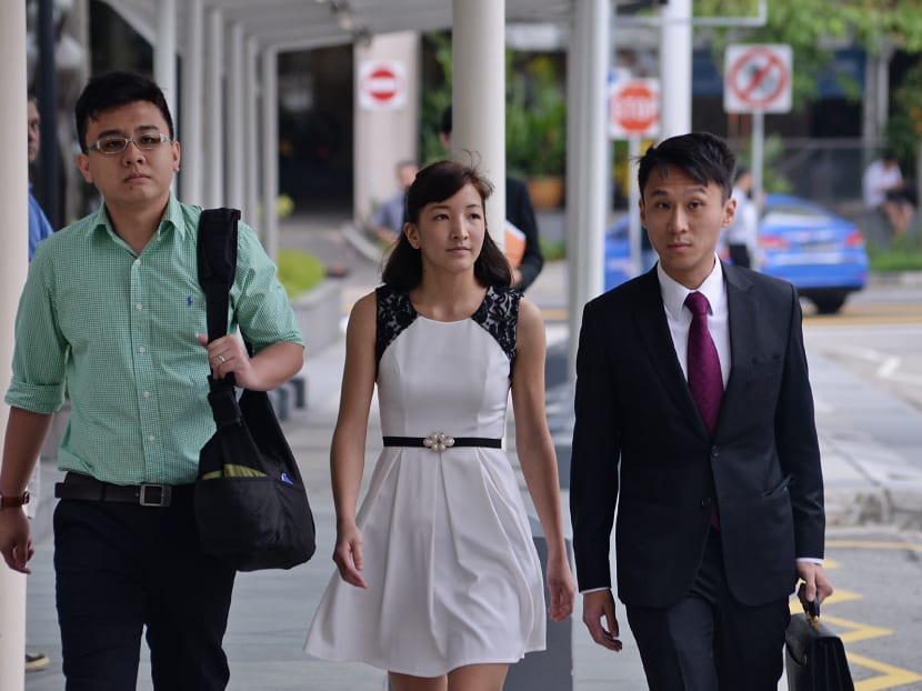 Mr Yang Kaiheng (left), Ms Ai Takagi (centre) walking into the State Courts, with their lawyer on March 7, 2016. Photo: Robin Choo/TODAY