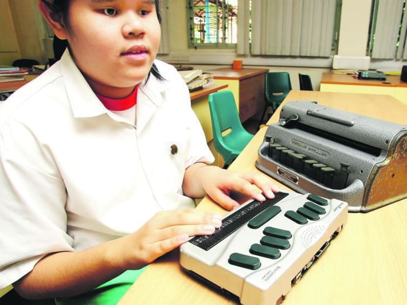 Students with special needs who are visually impaired using braille equipment to help them in their studies. TODAY file photo