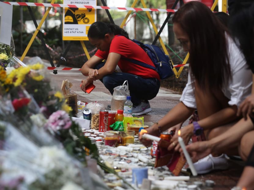 Members of the public gathering at the Lucky Plaza accident site on Jan 5, 2020. Some of them placed bouquets of flowers and food items there, while others lit candles in memory of the victims of the horrific crash on that took place on Dec 29, 2019.