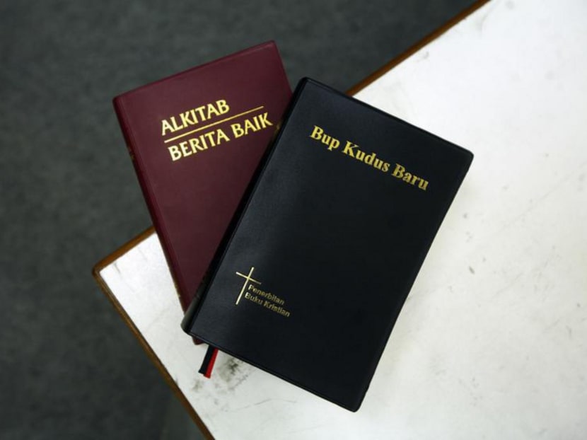 Copies of the Bible translated into Malay (left) and the Iban dialect (right). Reuters file photo.