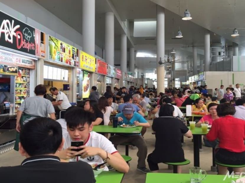Diners at Bedok hawker centre, where NETS FlashPay card payments will be accepted. Photo: Channel NewsAsia