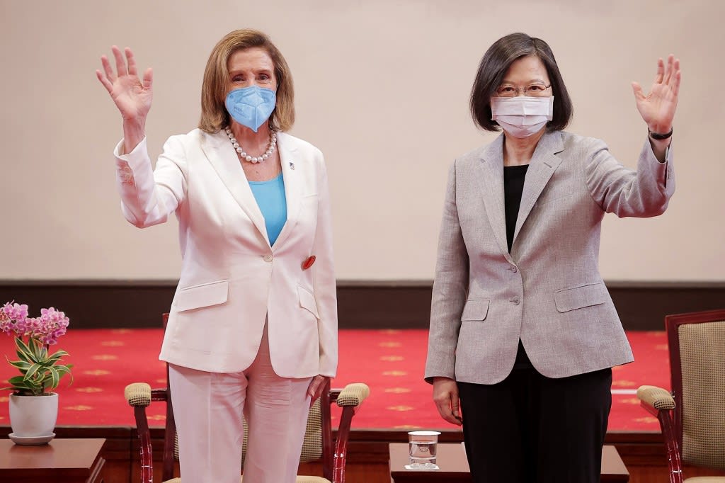 This handout taken and released by Taiwan's Presidential Office on Aug 3, 2022 shows US House Speaker Nancy Pelosi waving beside Taiwan's president Tsai Ing-wen at the Presidential Office in Taipei.