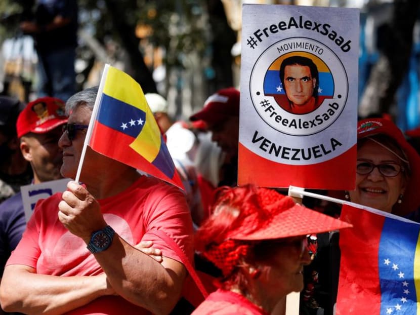 FILE PHOTO: Demonstrators of the "Free Alex Saab" movement participate in a rally in front of the National Assembly of Venezuela demanding the release of Saab, a Colombian businessman with Venezuelan ties who was extradited to the U.S. on a charge of money laundering, in Caracas, Venezuela December 16, 2022. REUTERS/Leonardo Fernandez Viloria