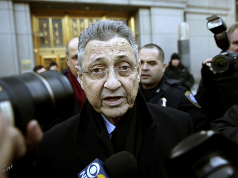New York State Assembly Speaker Sheldon Silver is surrounded by media as he leaves a federal courthouse in New York, Jan 22, 2015. Photo: AP