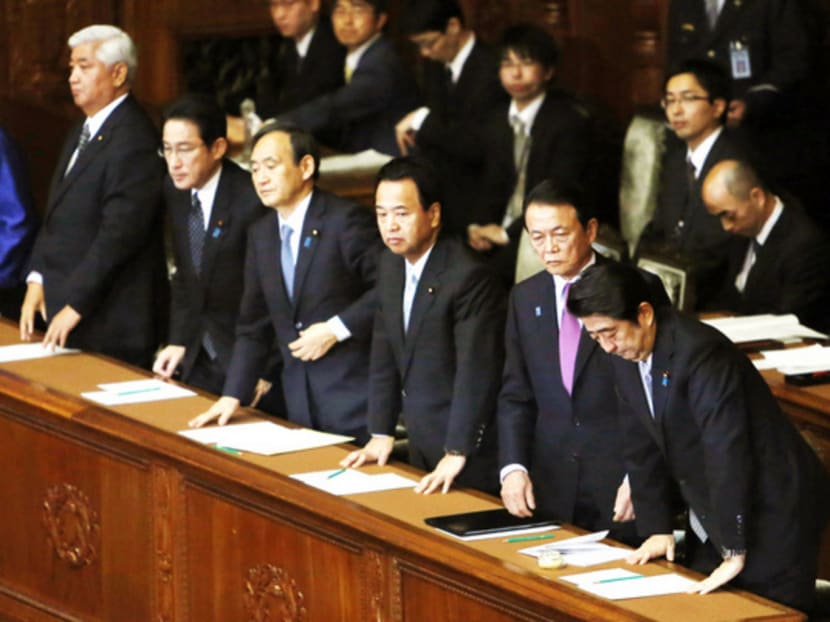 Prime Minister Shinzo Abe (right) in Parliament yesterday as Japan scrambles to save its hostage. Photo: Reuters