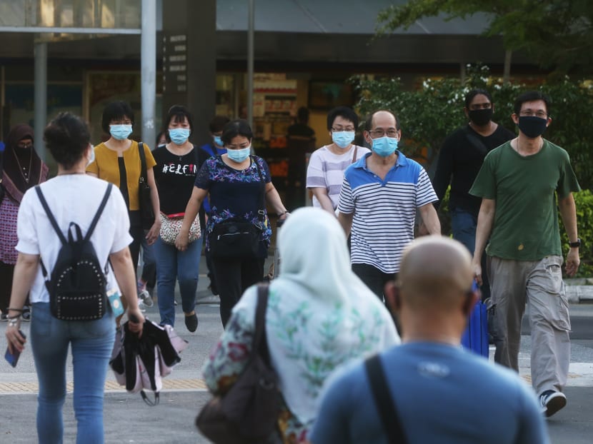 People wearing face masks at Jurong East on April 15, 2020.