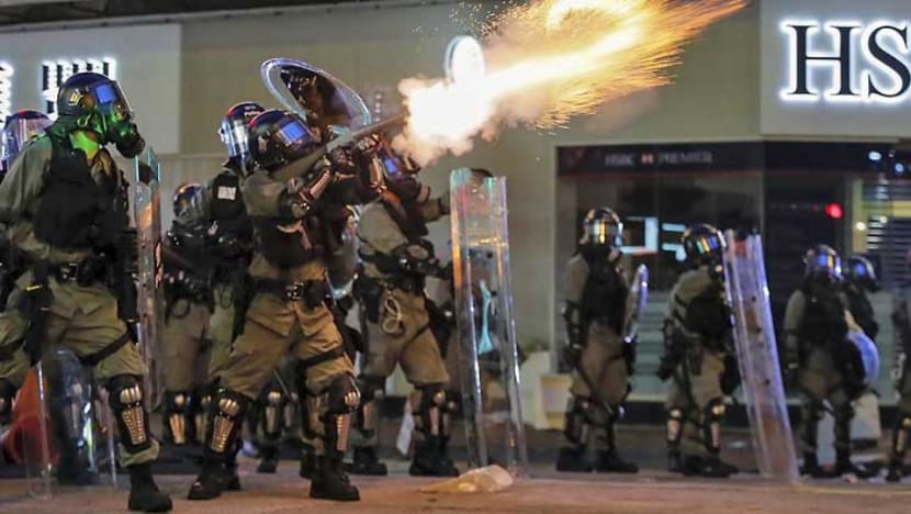 Hong Kong police fire tear gas at protesters in train station Hong Kong police fire tear gas at protesters in train station