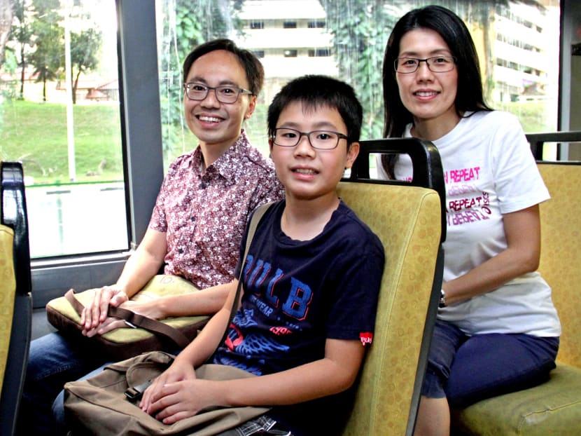 The Lim Family onboard a public bus: Walter Lim, 44, Ethan Lim, 11, and Tina Tan, 43. Photo: Jaslin Goh