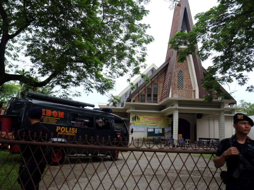 Police are seen outside Saint Joseph catholic church after a suspected terror attack by a knife-wielding assailant on a priest during the Sunday service in Medan, North Sumatra, Indonesia on Aug 28, 2016. Photo: Antara Foto via Reuters