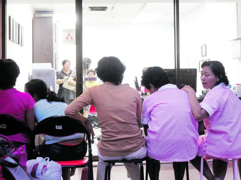Foreign domestic helpers at a maid agency. TODAY file photo