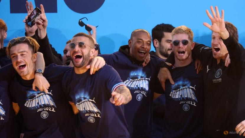 Champions Manchester City paint town blue with open top bus parade