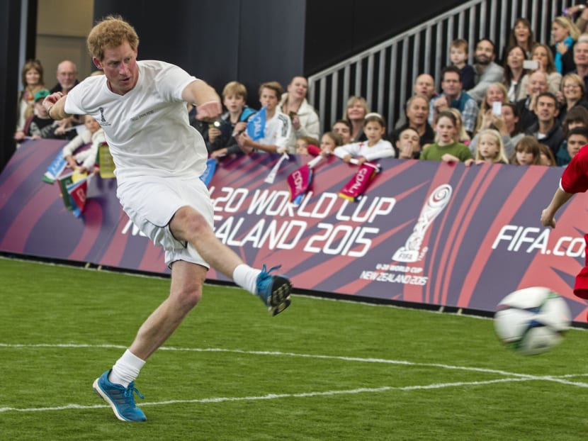 Britain's Prince Harry kicks the ball during a 5-a-side football game at The Cloud, a multi-purpose venue in Auckland, New Zealand, Saturday, May 16, 2015. Photo: AP