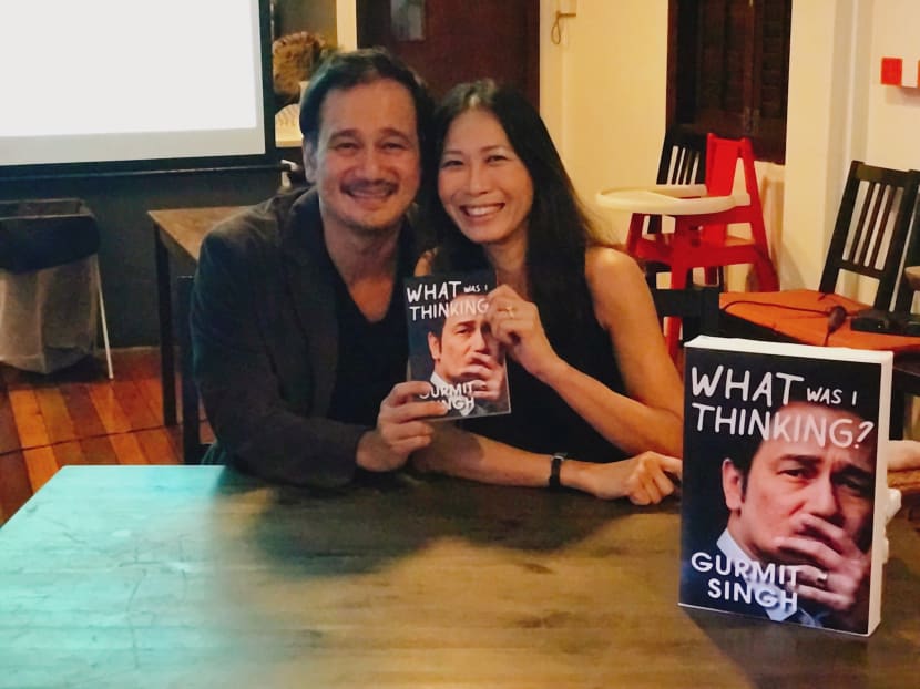Gurmit Singh and his wife, Melissa Wong posing with his book at the press conference on June 23. In the book, Singh shares about his journey  from a child to his pre TV career days to a TV artiste, and becoming a father. Photo: Sonia Yeo