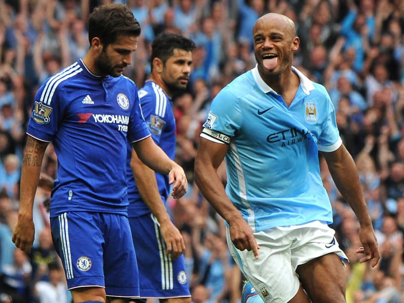 Manchester City’s Vincent Kompany, right,  celebrates after scoring against Chelsea. Photo: AP