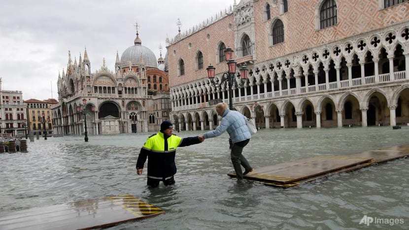 St Mark's Square closed as water again invades Venice, rain lashes Italy