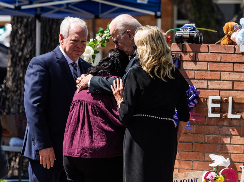 US President Joe Biden embraces Mandy Gutierrez, the principal of Robb Elementary School, as he and First Lady Jill Biden pay their respects in Uvalde, Texas on May 29, 2022,