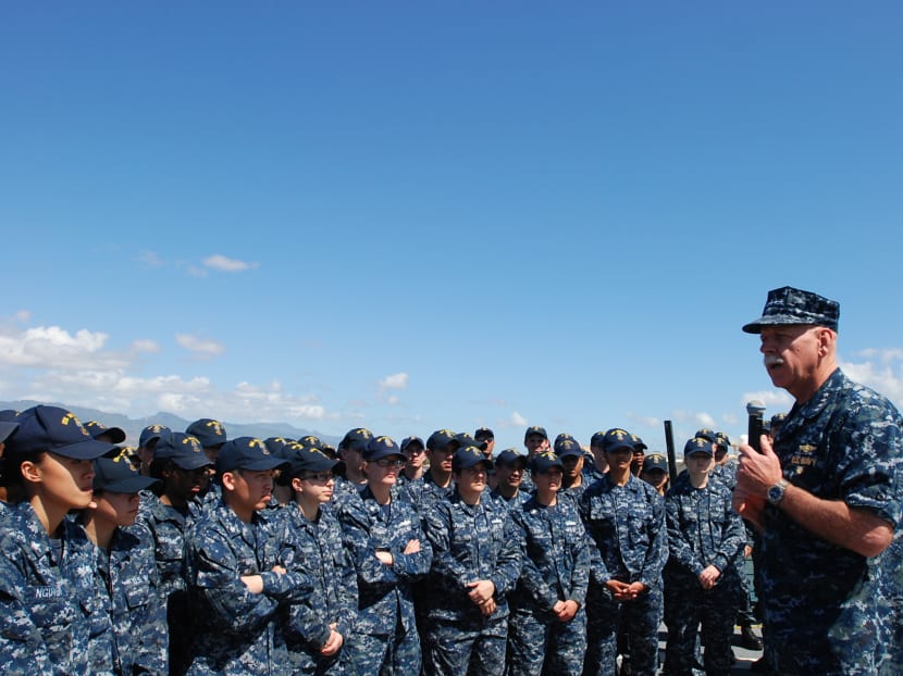 US Pacific Fleet commander Adm Scott Swift, right, talks to sailors on board the USS Momsen in Pearl Harbor, Hawaii on Tuesday, April 26, 2016. Adm Swift says he plans to expand the role of the US 3rd Fleet commander and her staff. Photo:AP