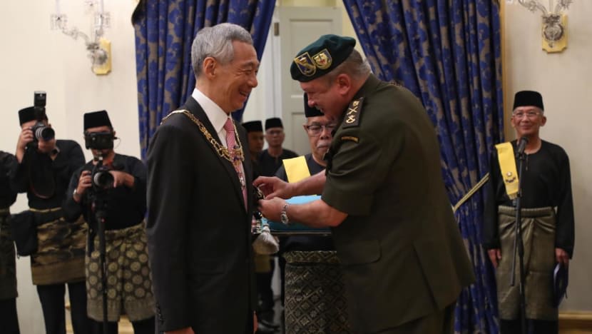 Prime Minister Lee Hsien Loong receiving the award from Sultan Ibrahim Ibni Almarhum Sultan Iskandar at the Johore State Award Investiture Ceremony on May 6, 2022.
