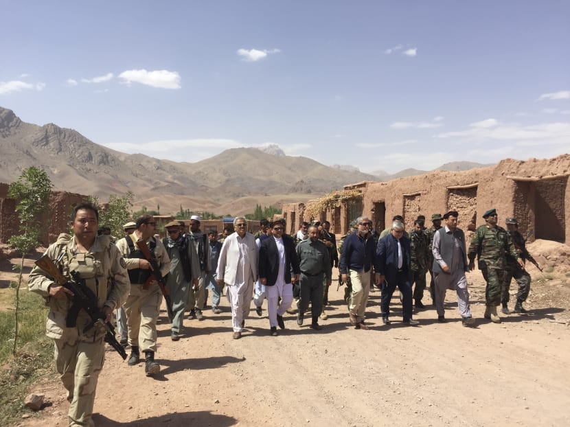 Afghan government officials assess the situation in the Taiwara District after it was recaptured from the Taliban, July 31, 2017. The brief fall and recapture of Taiwara shows how the fighting is being waged now: The government and militants wrest control, only to lose it soon after. Photo: The New York Times