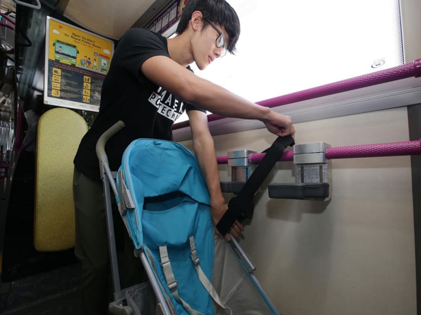 A prototype stroller restraint system being demonstrated in a preview. The system, designed for strollers that face forward or backward, will be tested on SBS Transit Service 69 from today. PHOTO: Wee Teck Hian