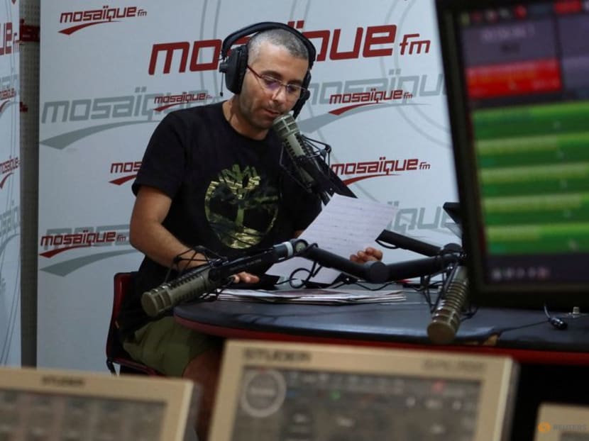 FILE PHOTO: Tunisian journalist Haythem El Mekki presents his segment in an episode of a radio show inside the studio of Mosaique FM, in Tunis, Tunisia October 4, 2022. REUTERS/Jihed Abidellaoui