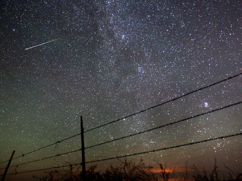A Perseid meteor shower in August 2013, streaking past the Milky Way above Wyoming, in the United States. 

In Singapore, stargazers should watch the event from a dark place and face the northeastern sky. Photo: AP
