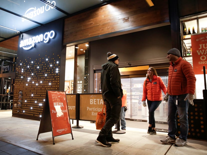 People outside the artificial intelligence powered checkout-free Amazon Go store. Chinese search engine Baidu has developed an AI-powered algorithm that could render supermarket managers obsolete. Photo: Reuters