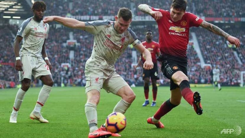 Football: Liverpool go top after stalemate at injury-hit United