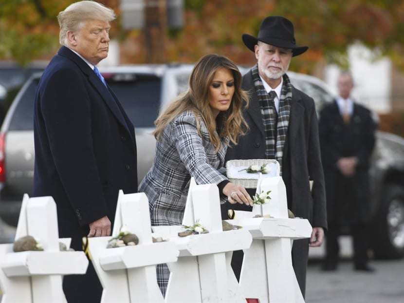 Photo of the day: United States President Donald Trump and First Lady Melania Trump placing stones on a memorial to shooting victims on Tuesday (Oct 30) as they stand with Tree of Life Synagogue's Rabbi Jeffrey Myers outside the synagogue, where a gunman killed 11 people and wounded six during a mass shooting in Pittsburgh, Pennsylvania.