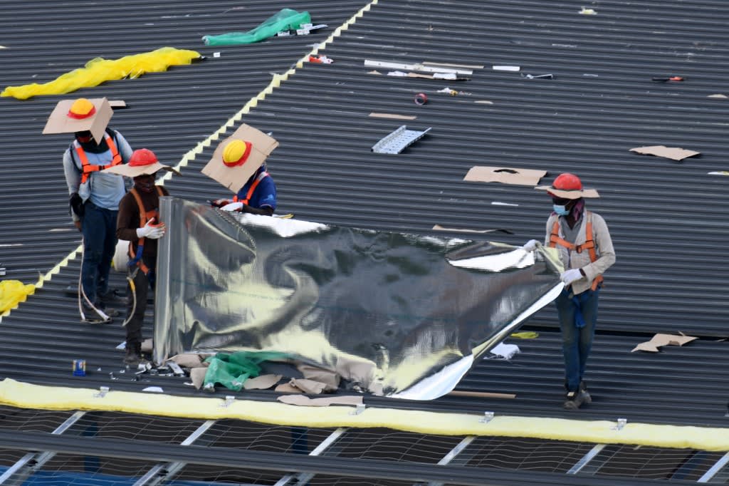 Migrant workers are seen working outdoors in Singapore at a construction site. A TODAY reader has called for more stringent penalties targeting employers amid the spate of workplace accidents in Singapore. 
