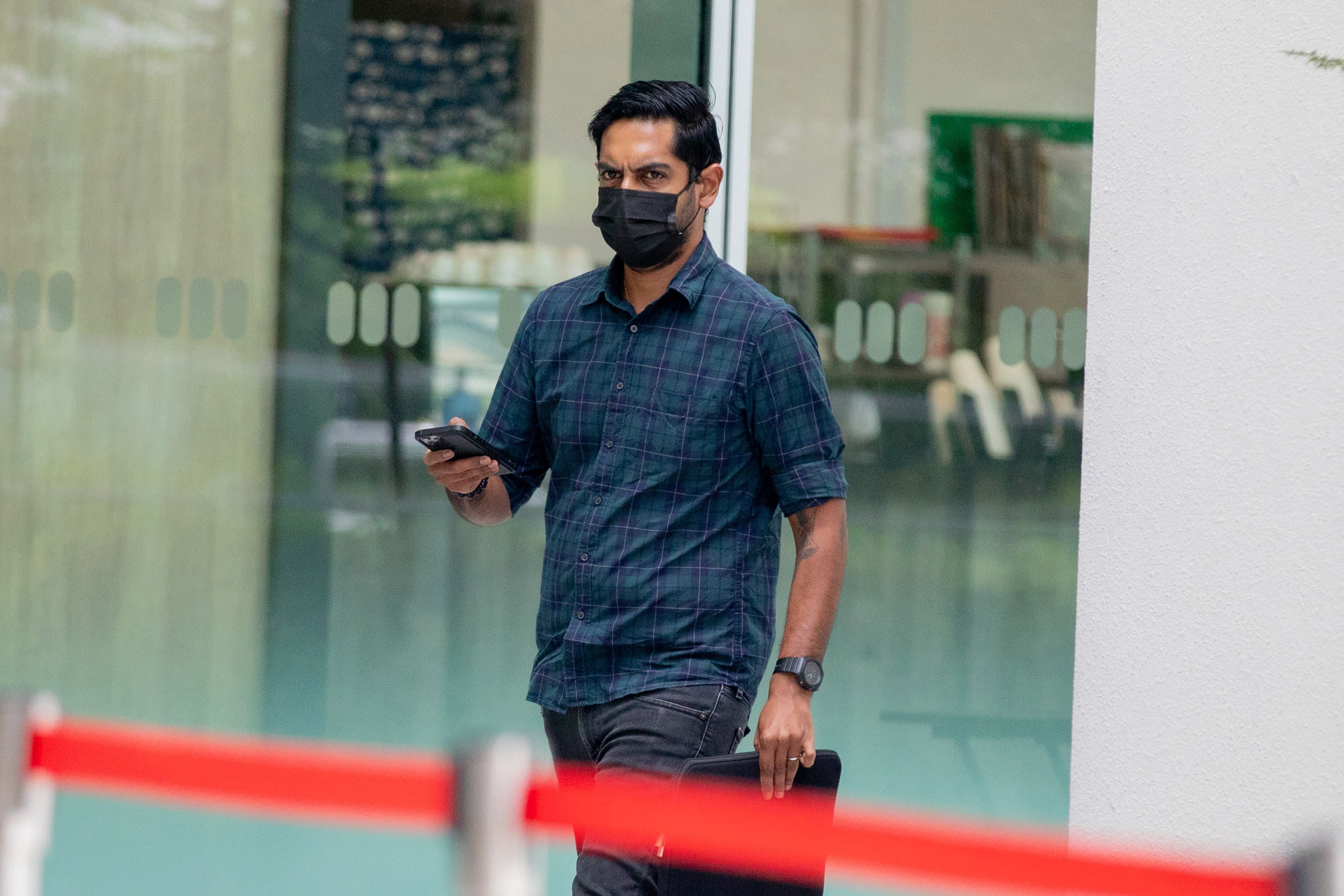 Sanjiv Kumar Sivaraj arriving at the State Courts on Jan 26, 2022. The 32-year-old was fined S$3,000 for verbally abusing a police officer. Sanjiv Kumar Sivaraj arriving at the State Courts on Jan 26, 2022. The 32-year-old was fined S$3,000 for verbally abusing a police officer.
